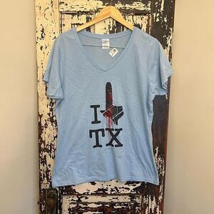 NWOT women’s V-neck Texas Chainsaw Massacre T-shirt. Size XL.